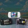 Handheld gaming consoles with colorful screens and game graphics.