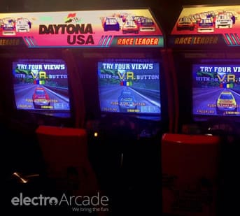 Arcade Daytona USA racing game with vibrant screens and arcade setup.