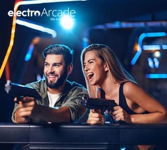 Two friends enjoying a classic arcade light gun shooter game at Electro Arcade.